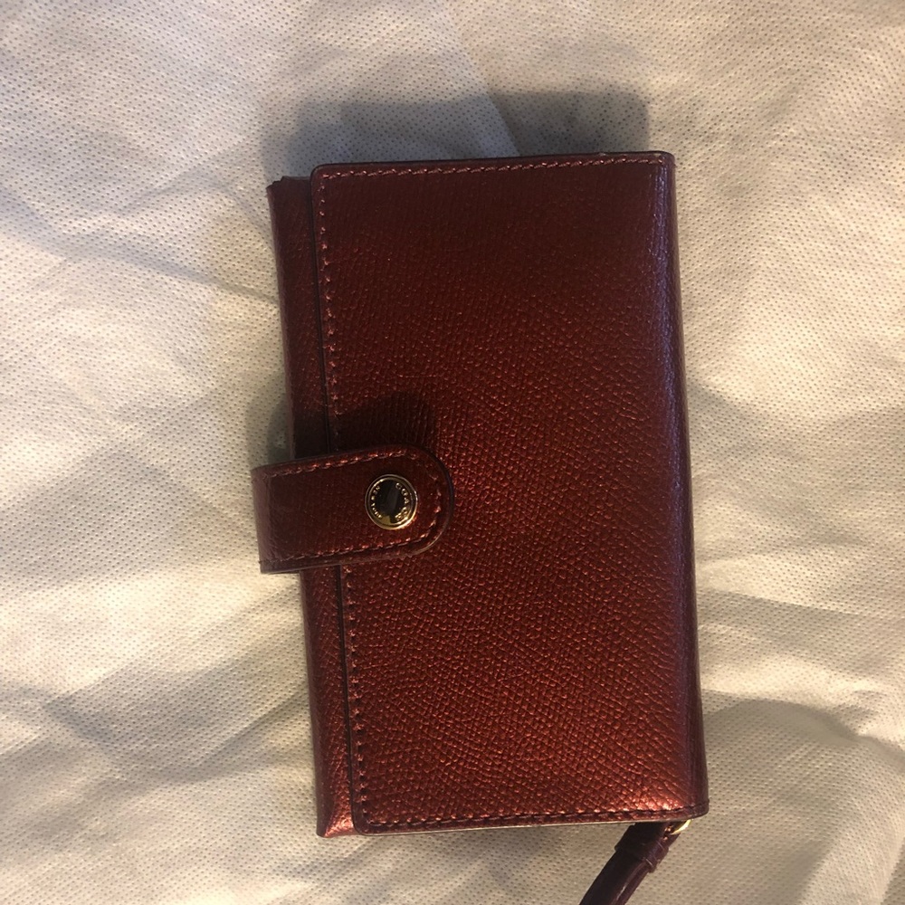 Brand new Coach wallet with wrist band